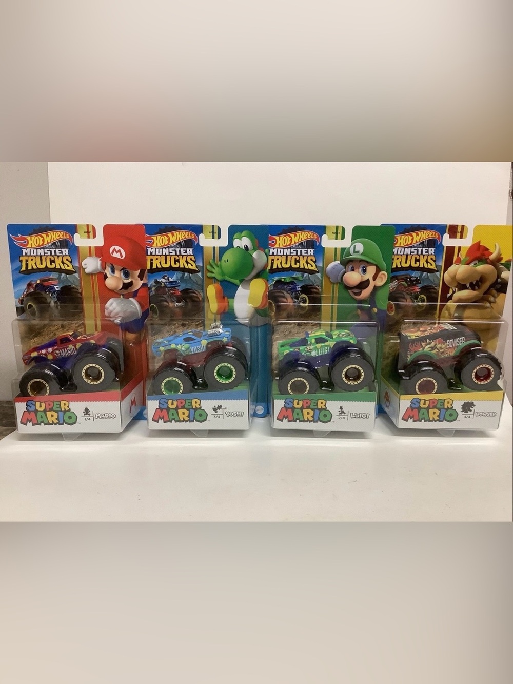 Hot Wheels Monster Trucks Super Mario Bros. 4 Truck Set Mario Luigi Bowser Yoshi